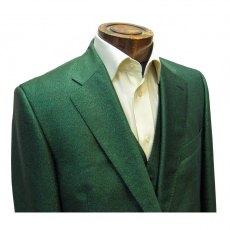 Suit in green glitter fabric