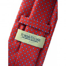 Silk tie: red with small blue spots