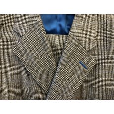 Light Prince of Wales check suit in 100% British wool with blue silk lining