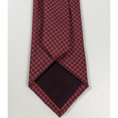 Silk tie: red with blue circles and yellow dots