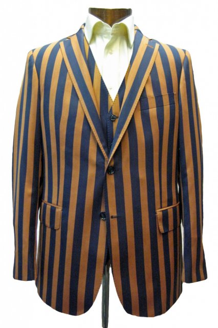 Three piece suit in wide blue and gold stripes