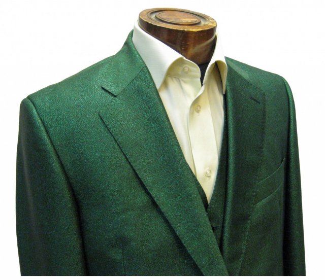 Suit in green glitter fabric