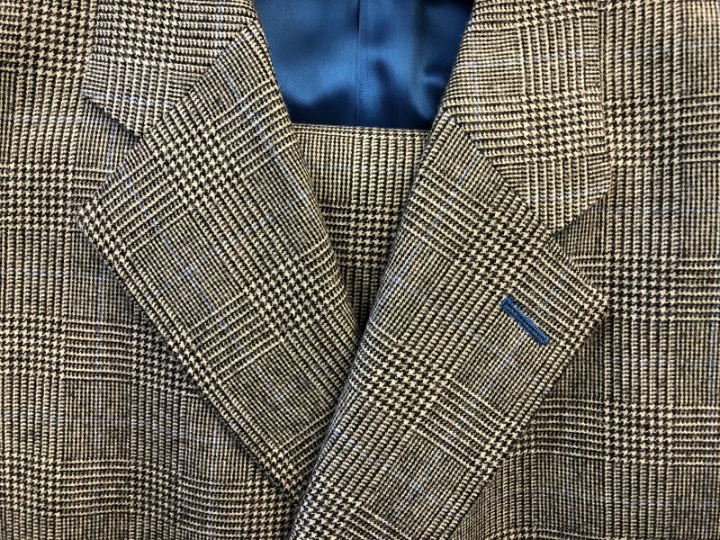 Light Prince of Wales check suit in 100% British wool with blue silk lining