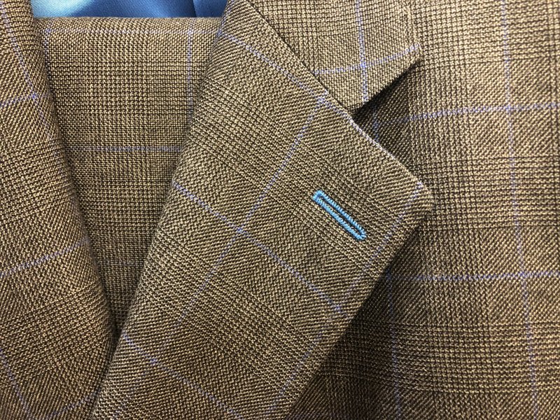 Prince of Wales dark check suit in medium weight British wool with pale blue details